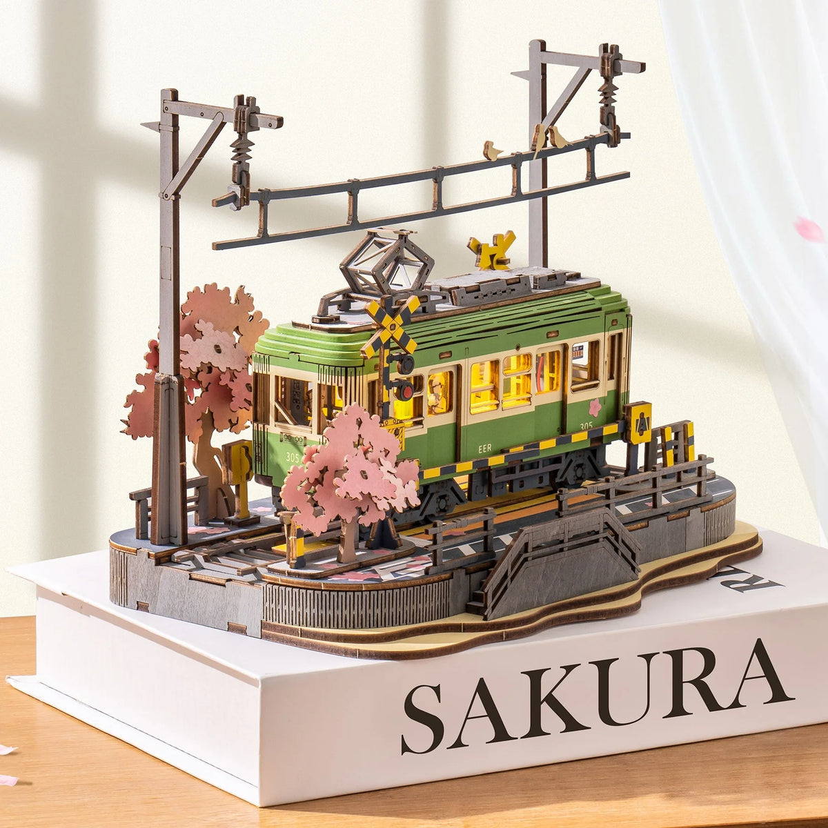Sakura Journey Tram model detail showing cherry blossom tram scene