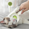 Green round self-cleaning brush grooming a cat
