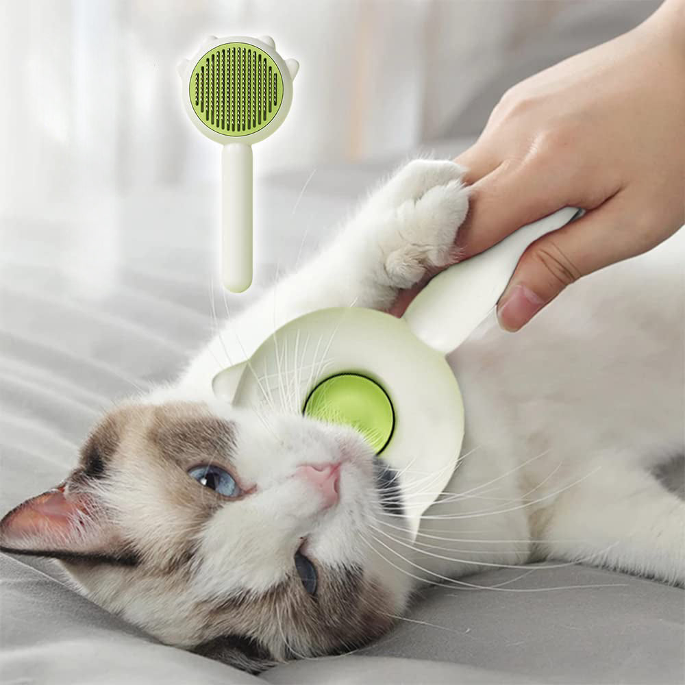 Green round self-cleaning brush grooming a cat